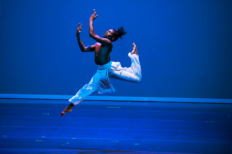 African American Dance Company male dancer solo performing.